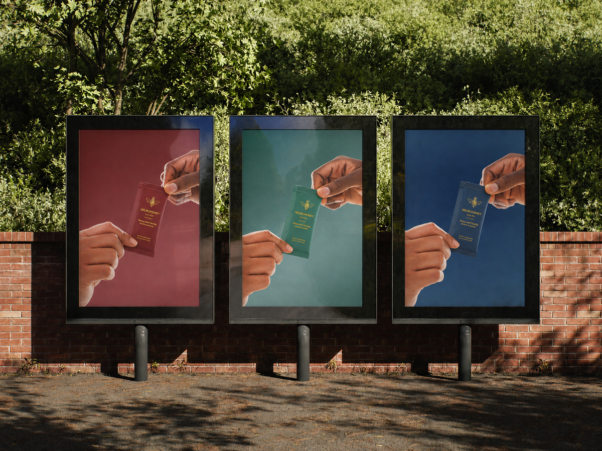 Three NeuroHoney sachets, one of each formula, held up on outdoor billboards